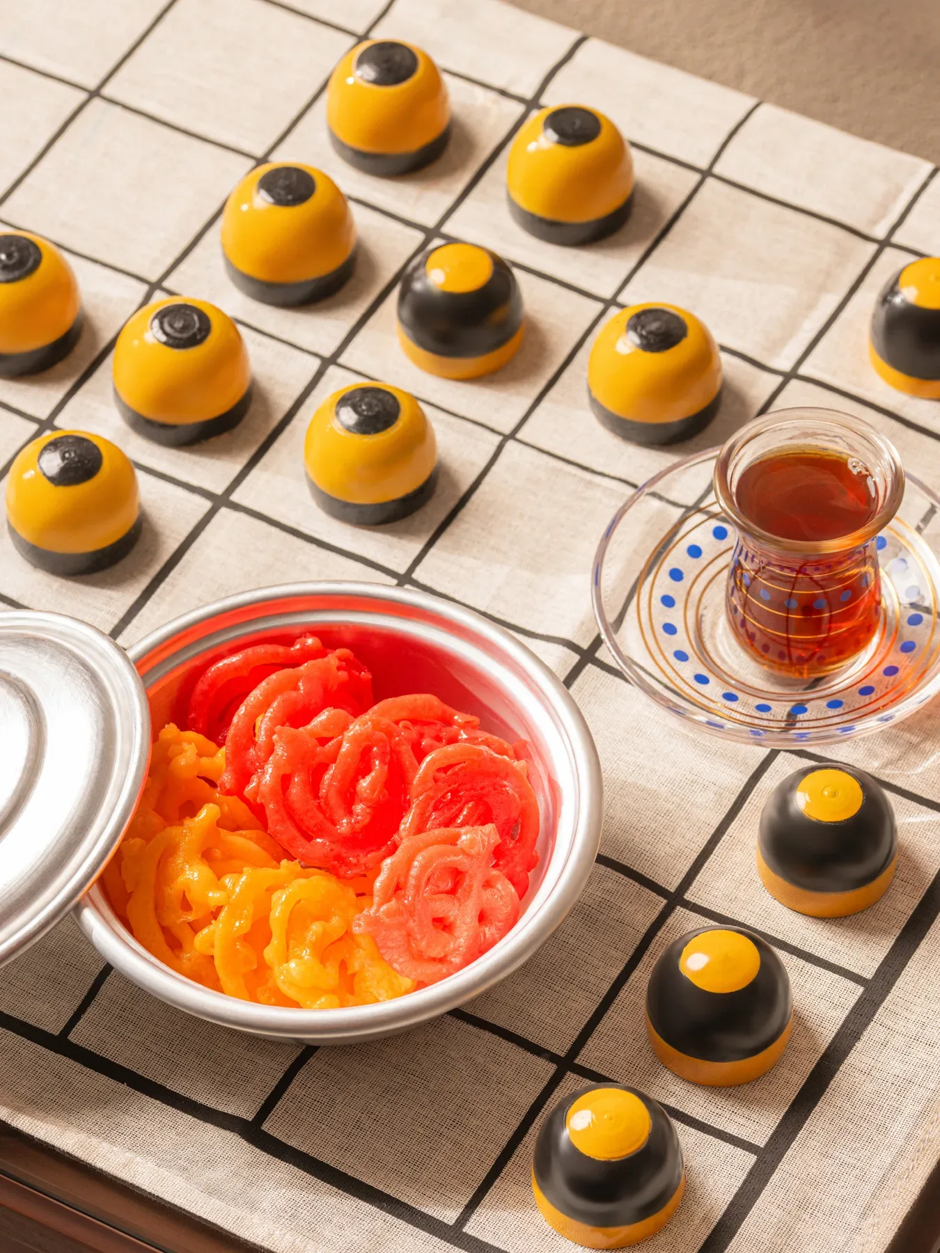Zalabia and tea served on a dama board, from the June layout.