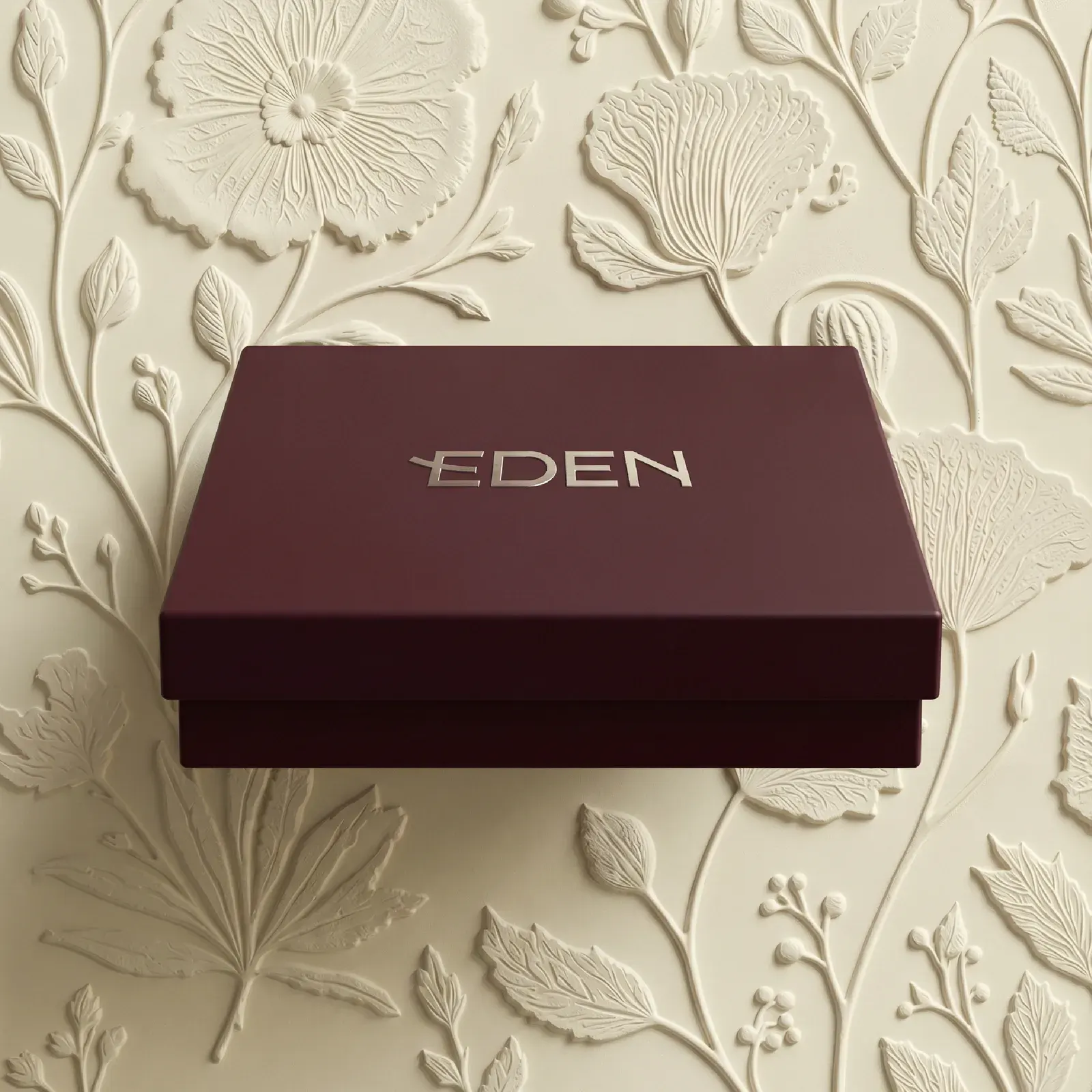 Highlight cover for chocolates, a closed Eden box on the floral relief.