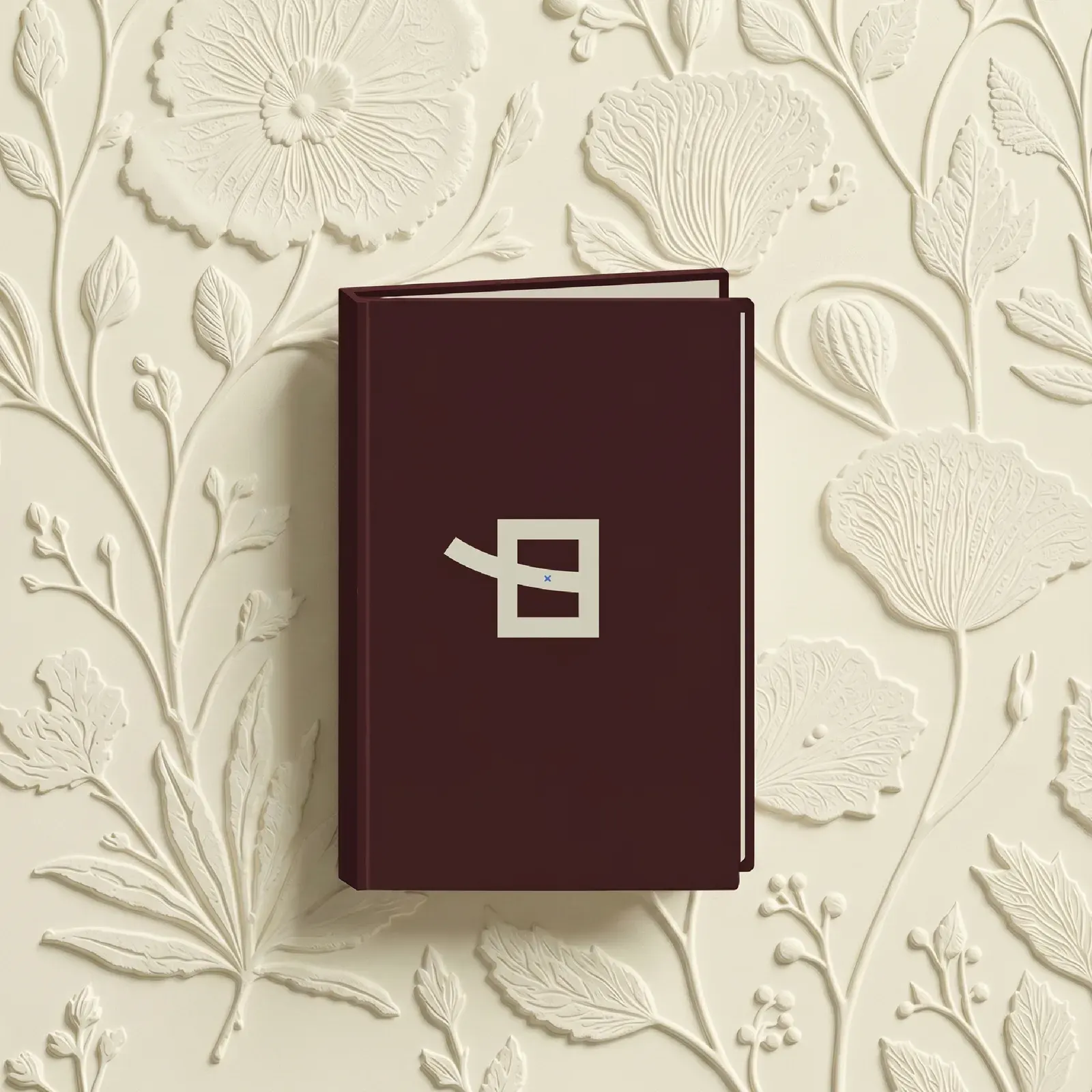 Highlight cover for the menu, a burgundy booklet with the Eden monogram.