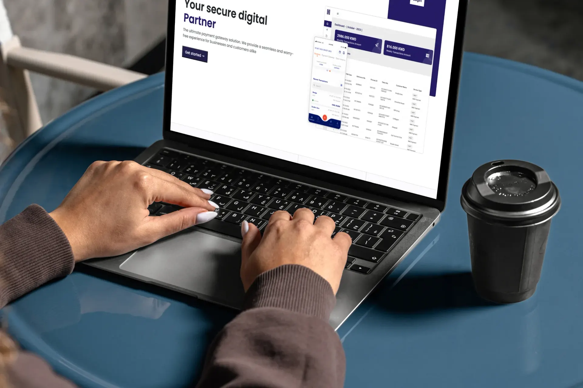 The Hesabe merchant portal open on a laptop at a cafe table.