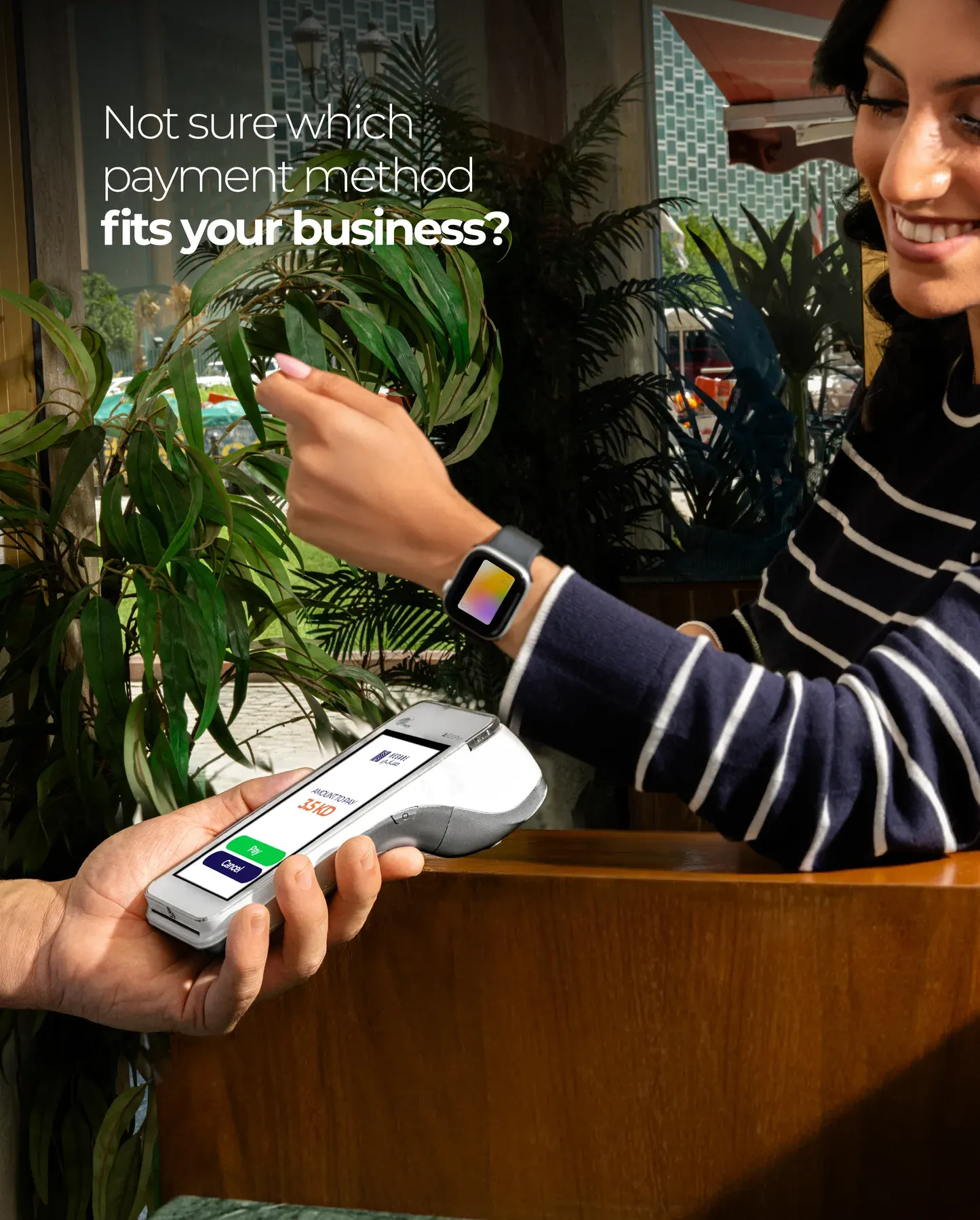 A customer paying at a shop counter, from the post on choosing a payment method.