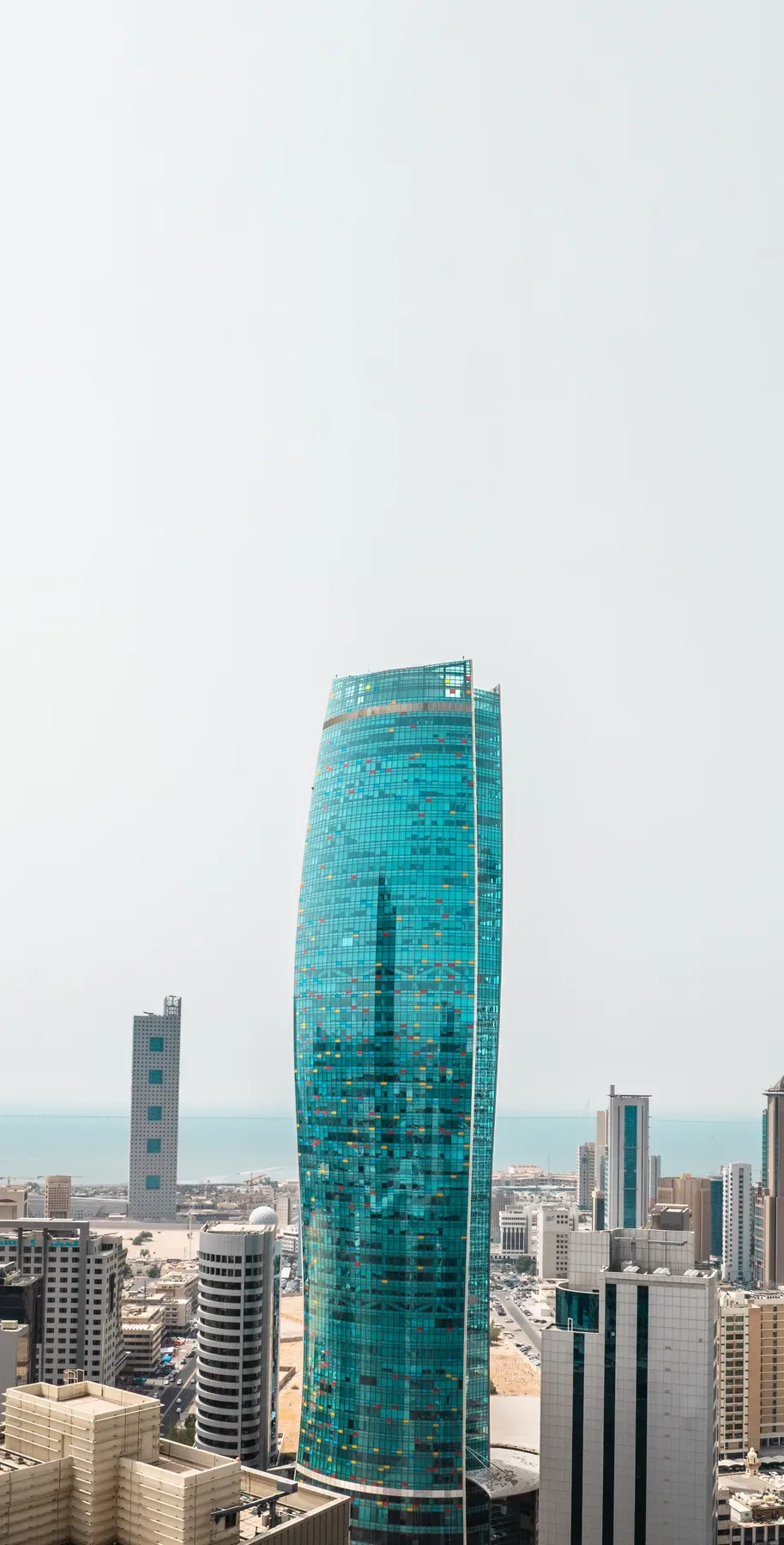 KIPCO Tower over the Kuwait City skyline and the sea, from the drone session in June 2025.