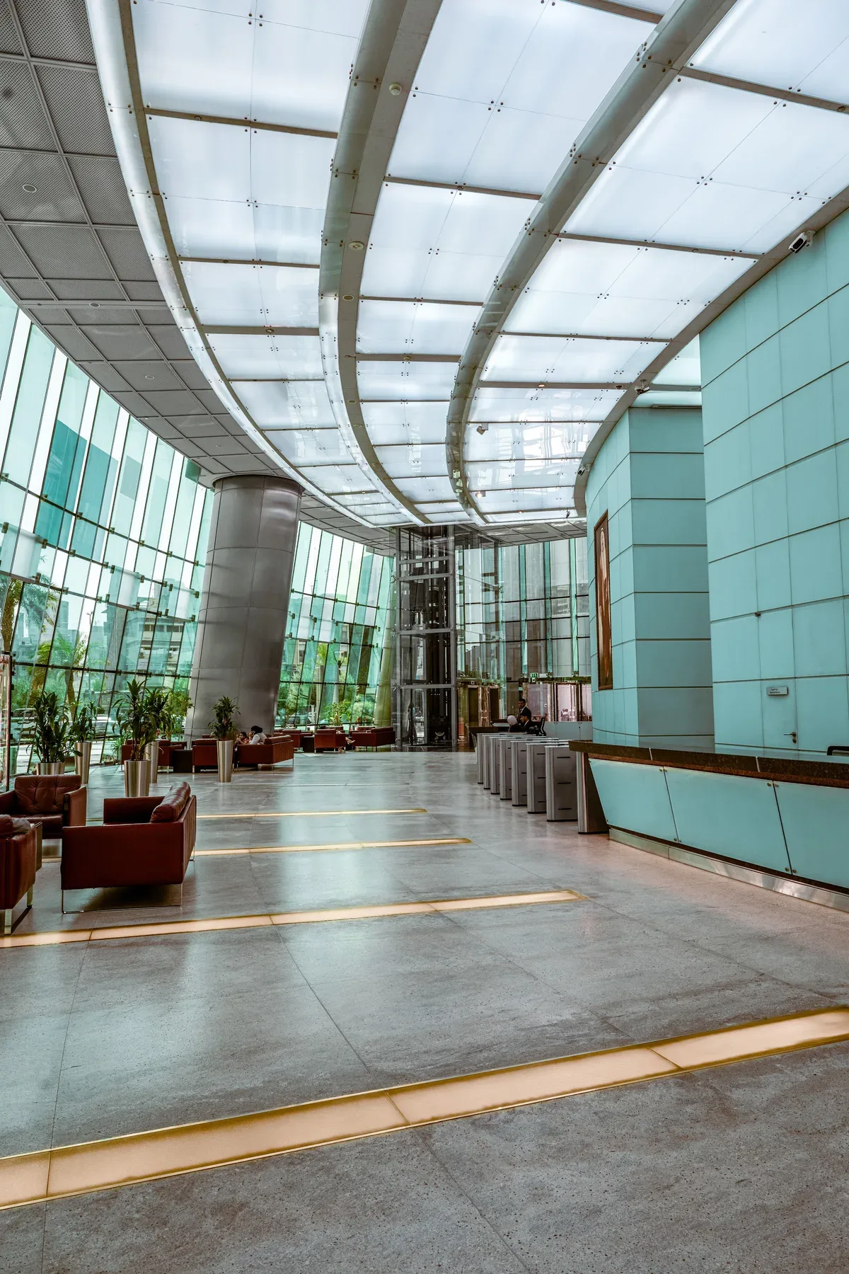 The atrium walkway under its curved glass roof.