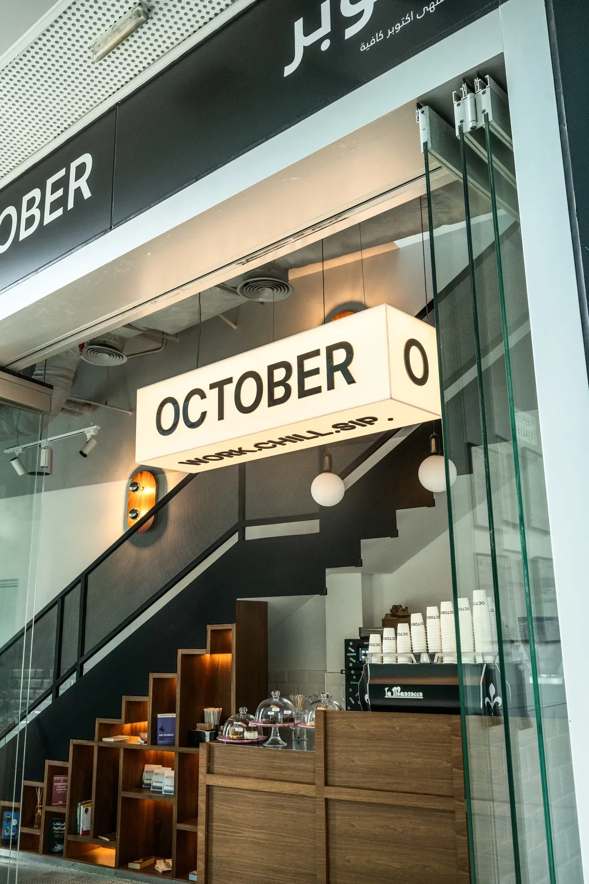 The light box sign over the stairs at October.