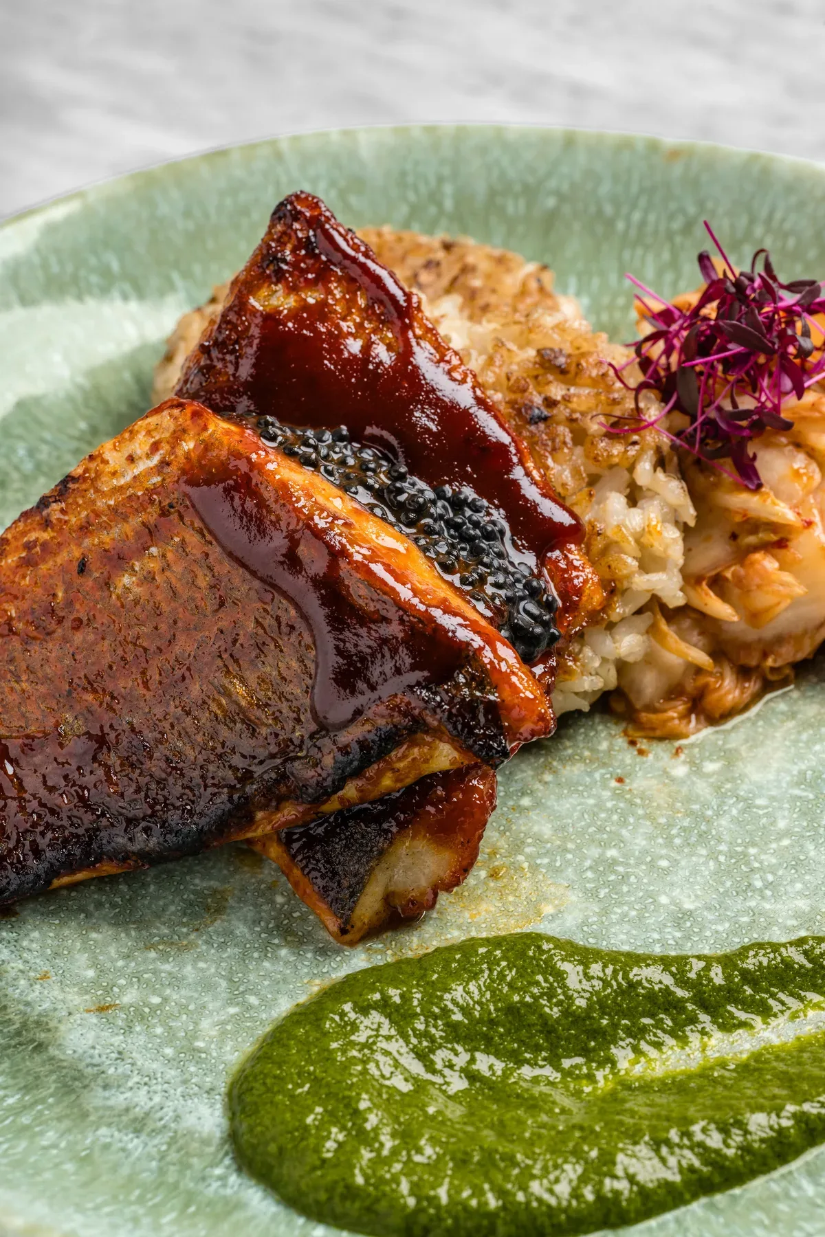 Glazed short rib with a green herb puree.
