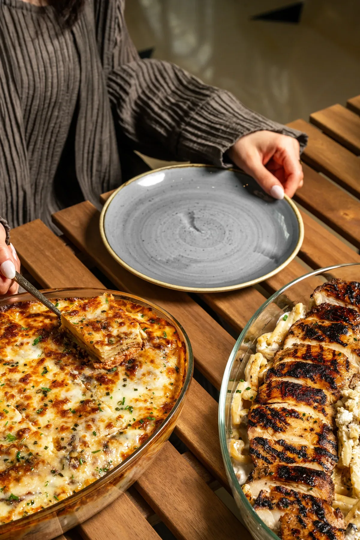 A flatbread topped with grilled kebabs at the iftar table.
