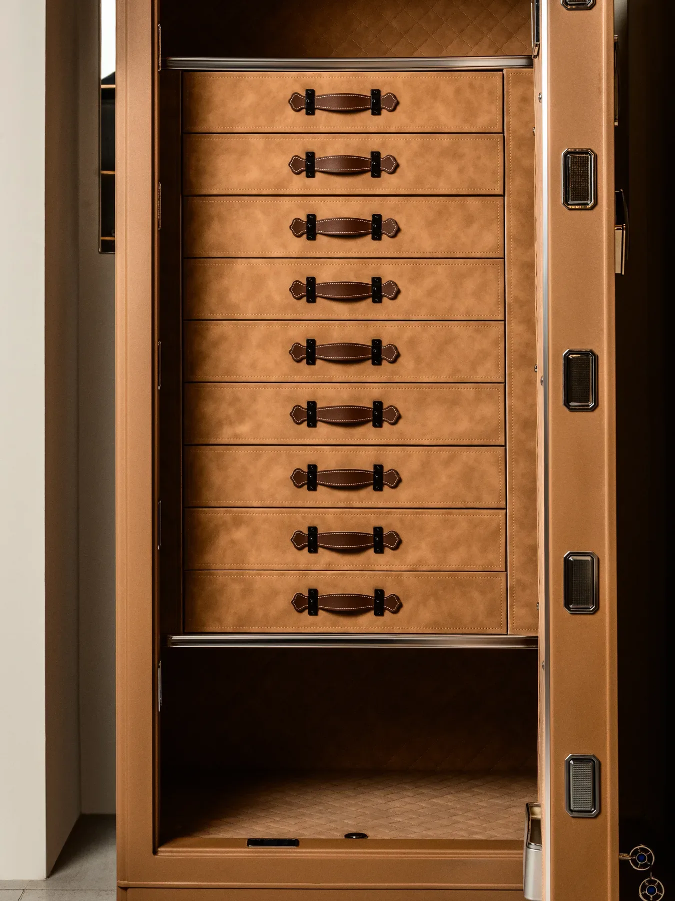 A tower of leather lined accessory drawers.