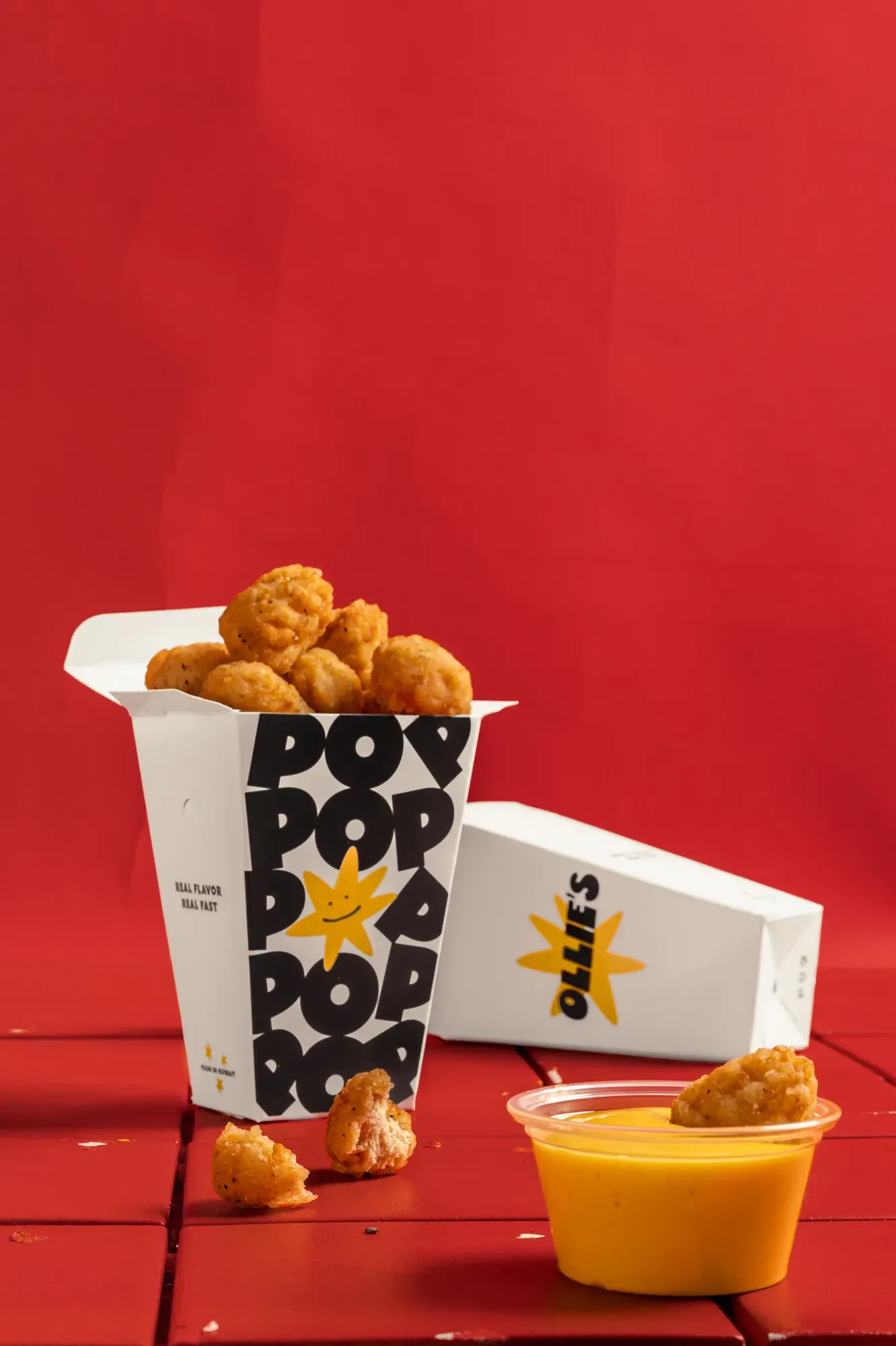 Pop Pop chicken and dip on red tile, framed square for the feed.