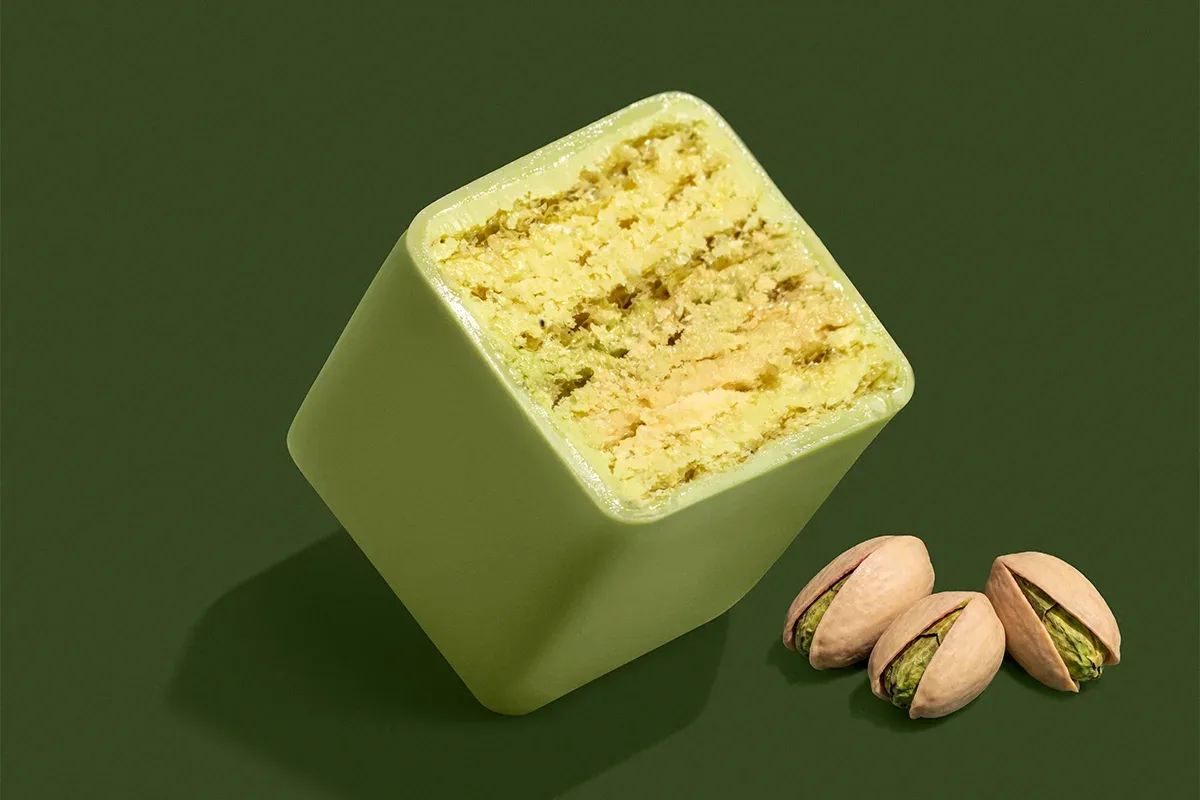 The Lovely Pistachio wafer cut open on its flavour colour.