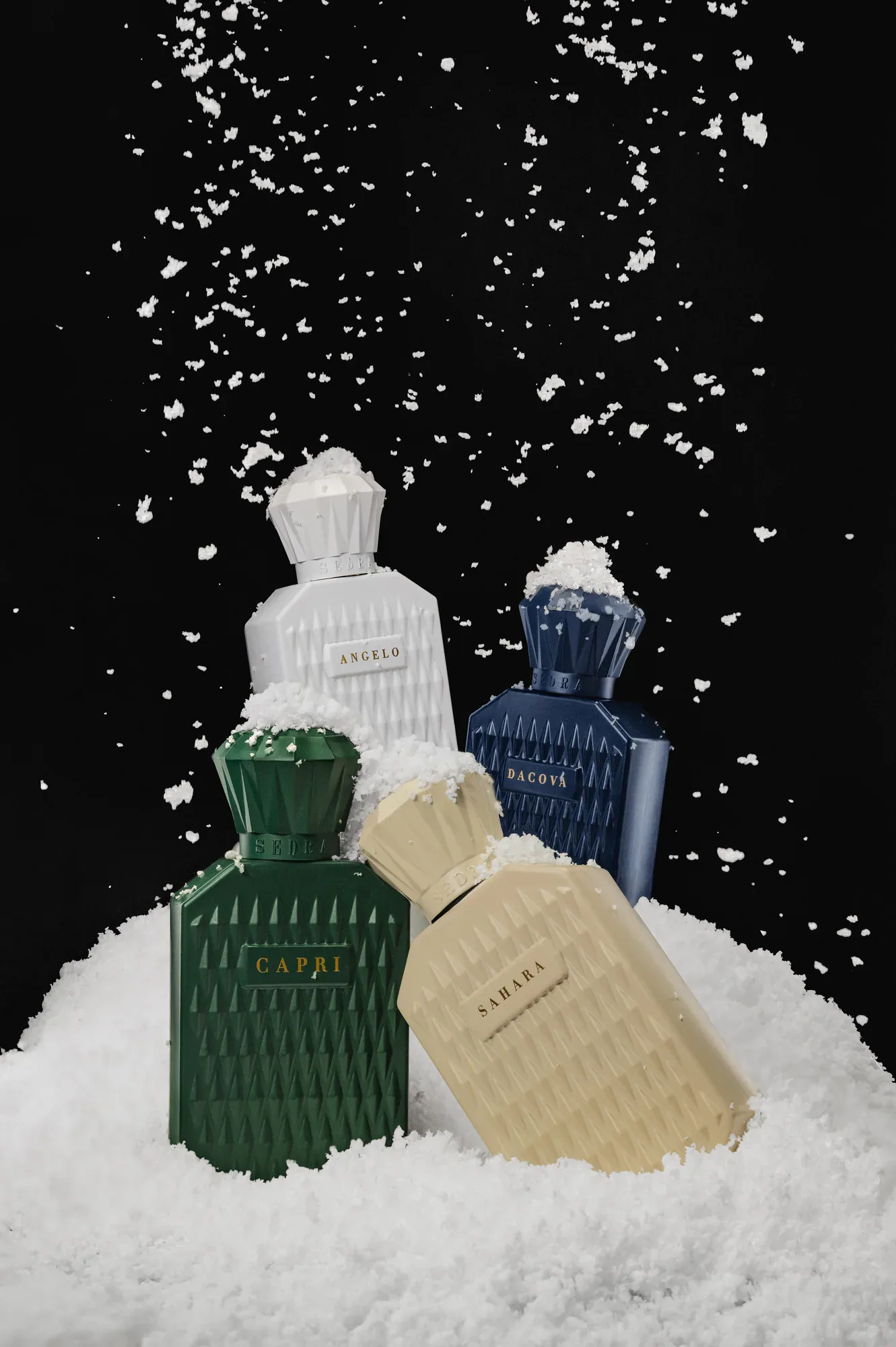 The collection shot together and packed in snow, so the four scents read as one family.